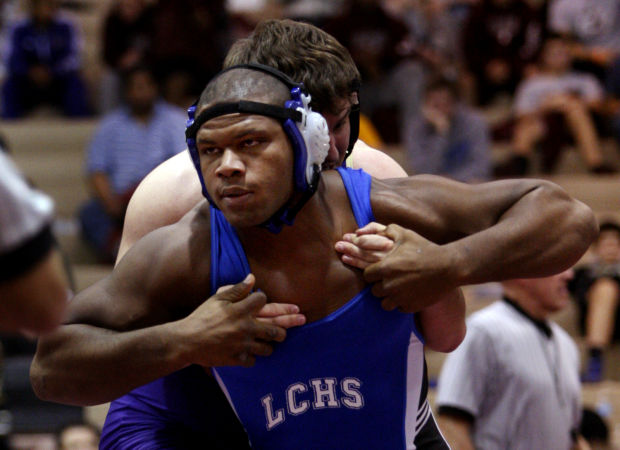 Lake Central's Gelen Robinson breaks a hold by Hobart's Jon Ramirez during Saturday's semifinals of the Lake County Championships.